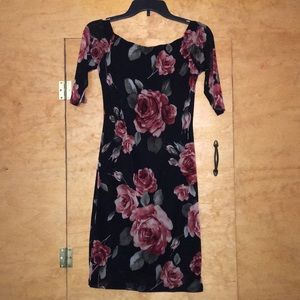 Black dress with roses all around the dress.